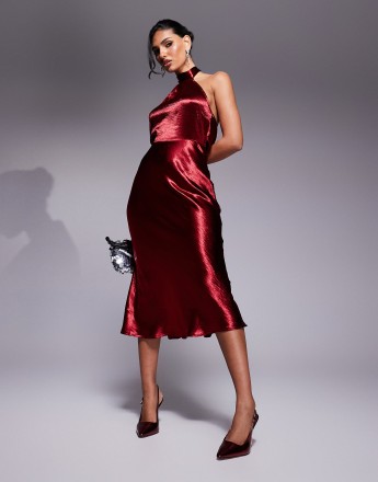 In The Style liquid satin halterneck cowl back midi dress in burgundy